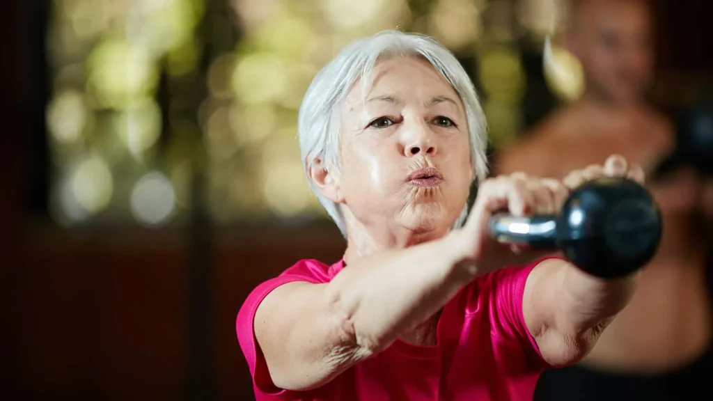 Toning Bingo Wings: Effective Exercises and Tips for Achieving Sleeker Arms 2 Person performing arm exercises with dumbbells Buxton