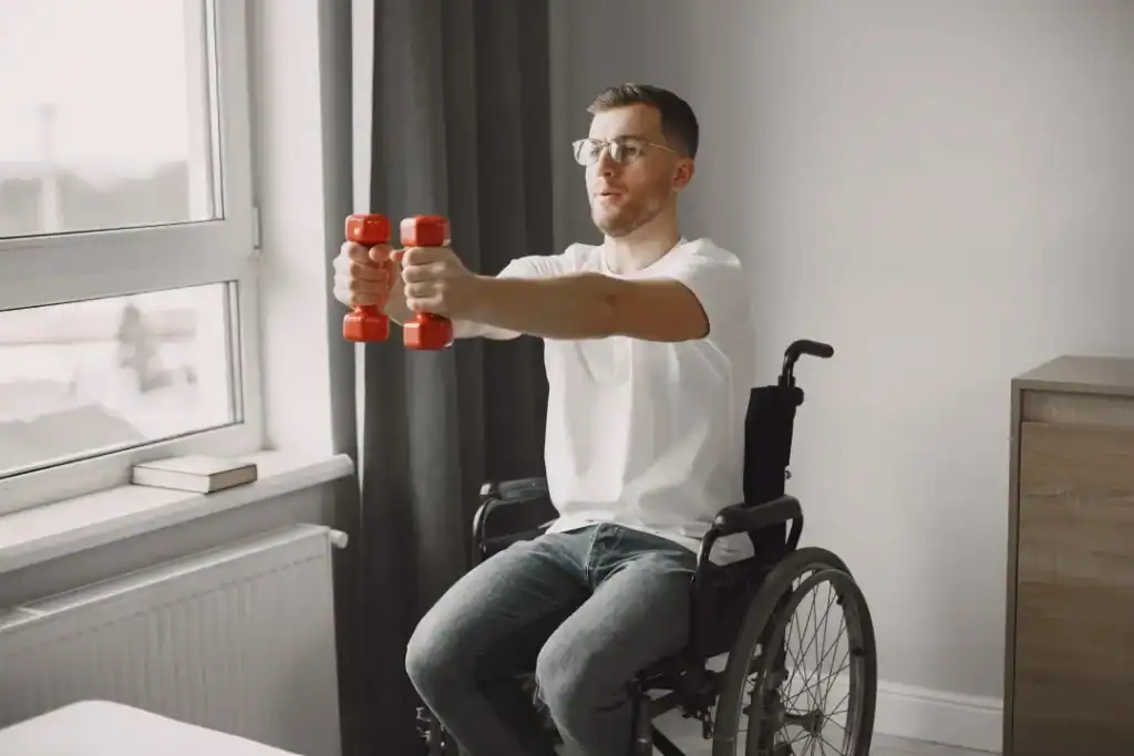 Empowering Weight Loss: A Comprehensive Guide for Individuals with Disabilities 1 Image of man doing exercise in his wheelchair to aid weight loss Buxton