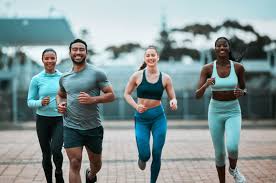 Sculpting Sleek Arms: The Essential Role of Cardio in Toning Without Bulking Up 3 image of people running to incorporate cardio Buxton exercise into their life to help tone arms and body.