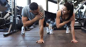 Image of man and woman doing Cardio Buxton to tone their arms. 